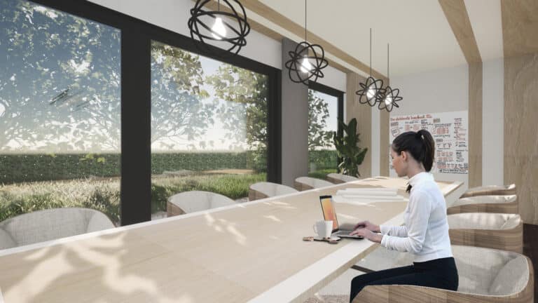 Havainnekuva missä nainen työskentelee MaarinPortin neuvotteluhuoneessa